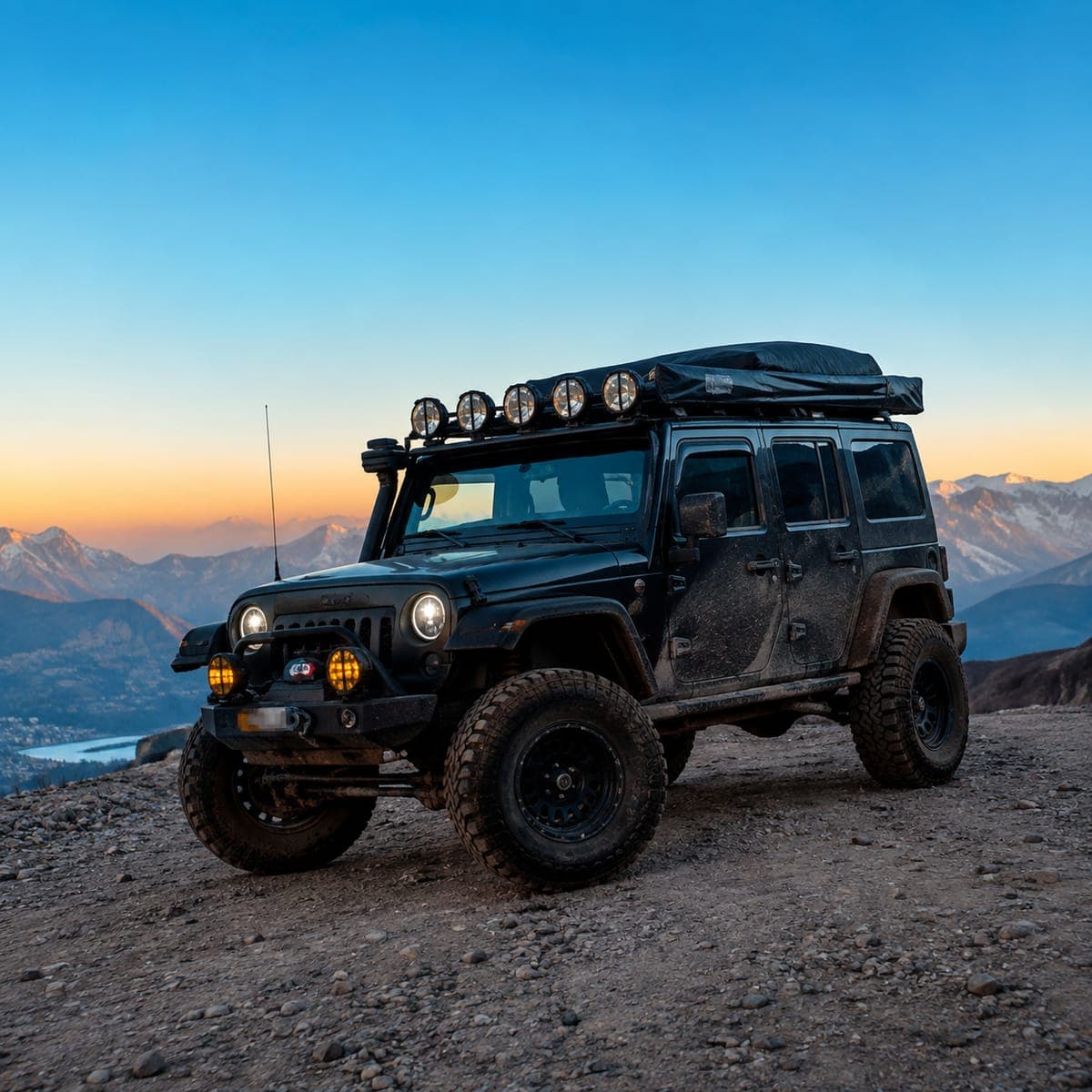 Off-road jeep parked on a rocky mountain track